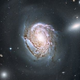 Illustration for article titled Majestic spiral galaxy is located in the cosmos's most crowded corner